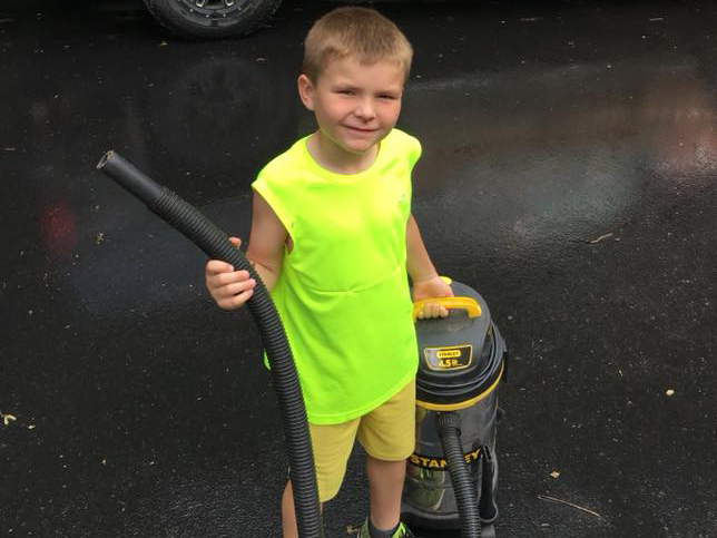 34117310_1715525545161515_3400214471669448704_n_h young boy holding a vacuum pump